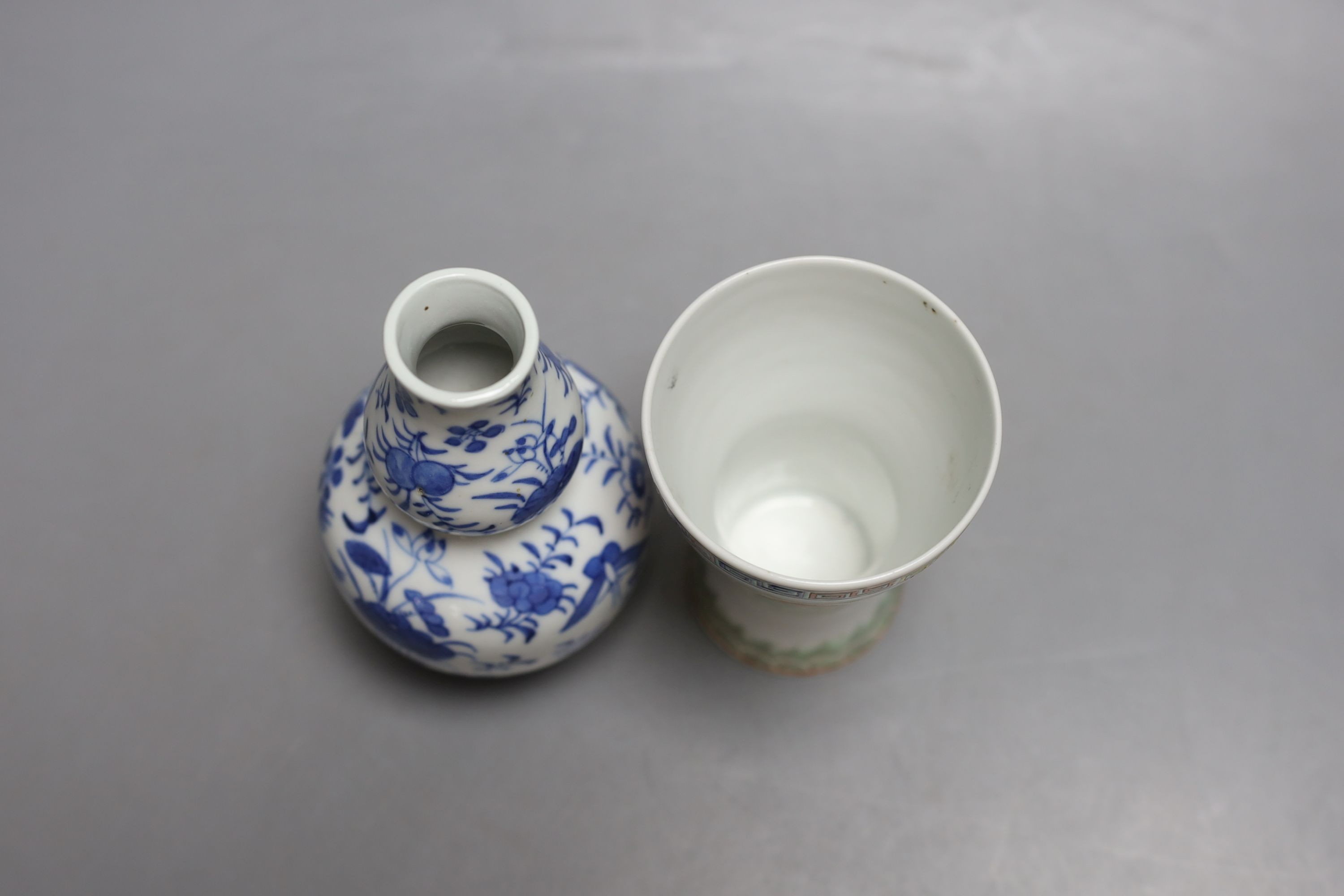 A 19th century Chinese blue and white gourd shape vase and a Chinese cup with inscription on base - tallest 14cm